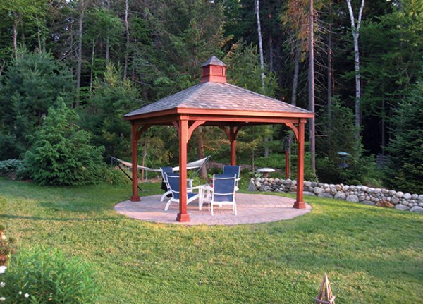 pavilion on a lawn with outdoor furniture