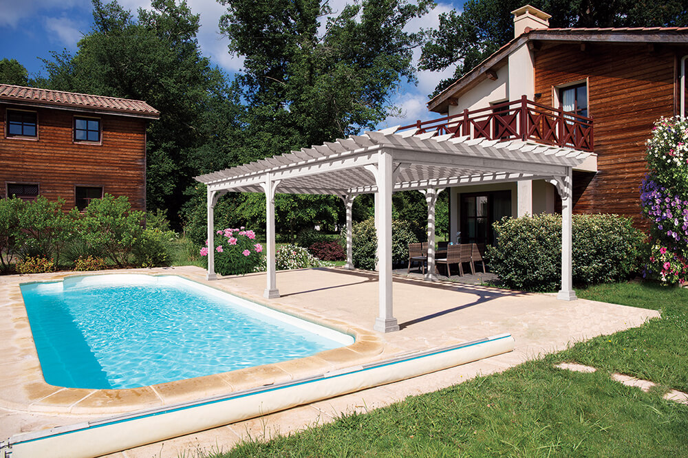 pergola next to a pool on a patio