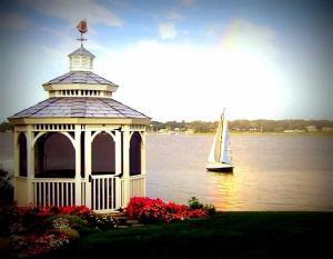 gazebo next to water in a garden