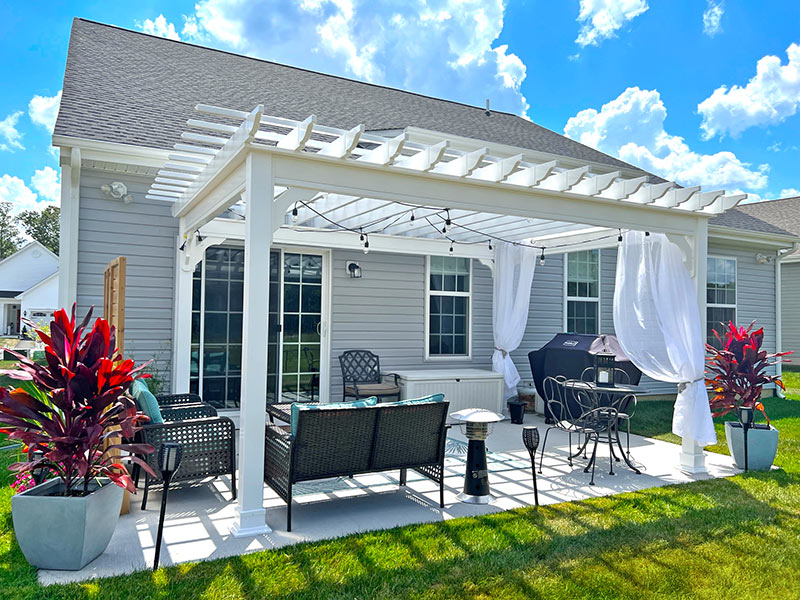 Classic Vinyl Pergola with curtains and string lights