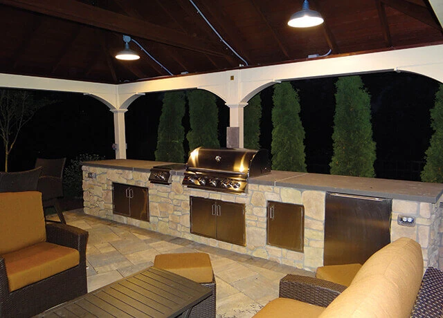 Outdoor pavilion with lighting and kitchen